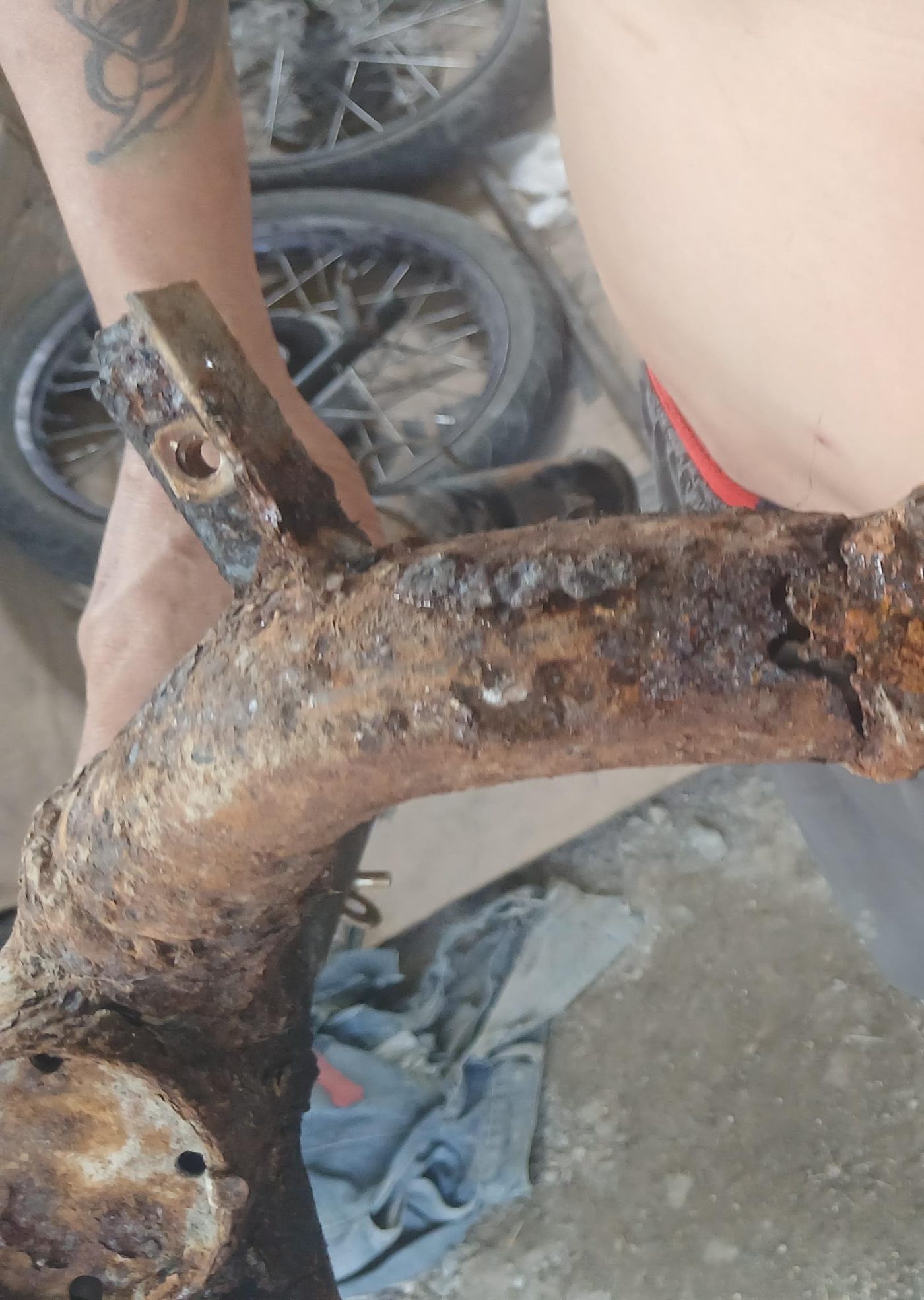 Cracked and corroded chassis section before repair